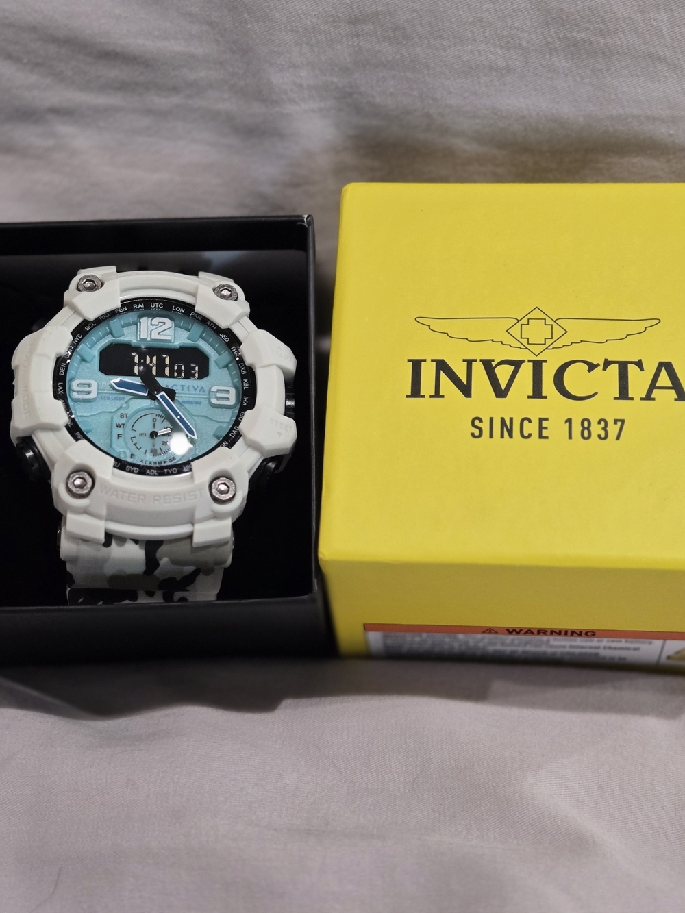Invicta White and Teal Men's Sport Watch